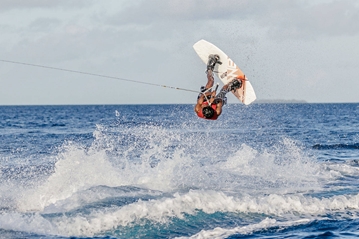 Man doing trick on wakeboard 