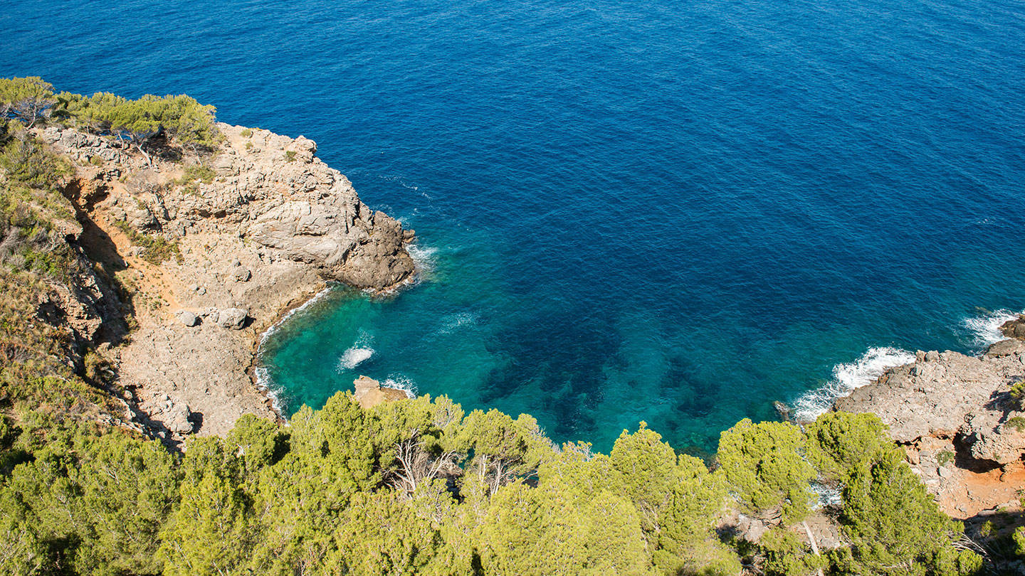 Aerial view of cliffside and blue seas