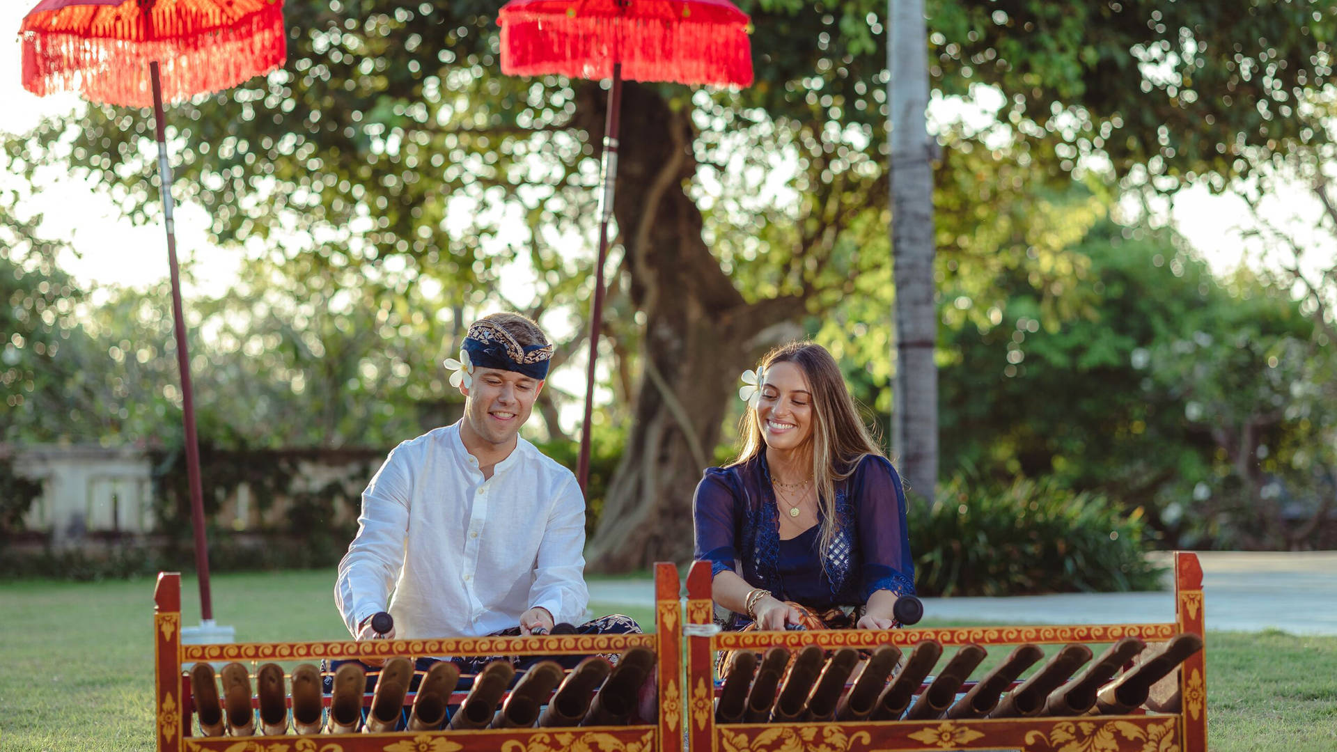 Couple taking part in a Bali Rindik music at Jumeirah Bali