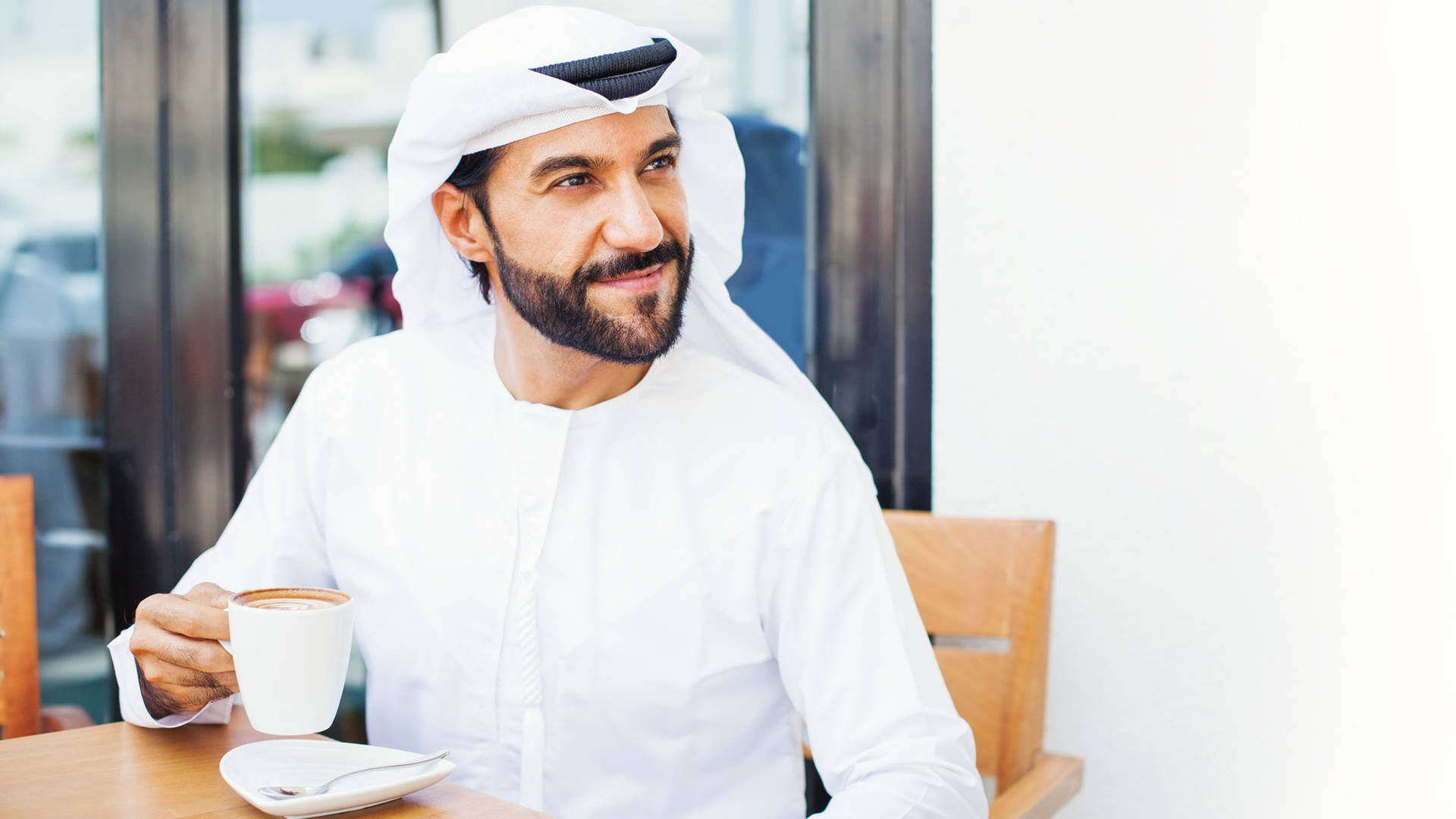 Dubai man drinking coffee