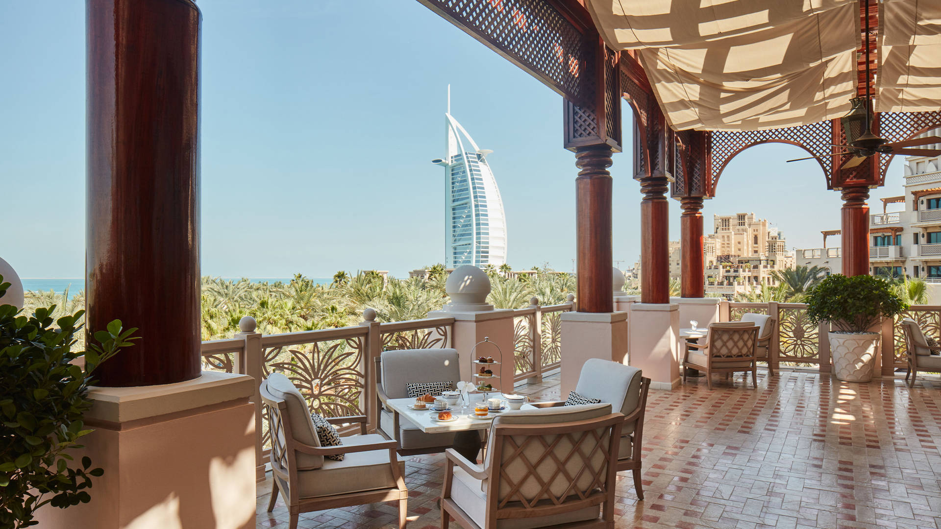 Image of Al Fayrooz terrace at Jumeirah Al Qasr, with views overlooking The Burj Al Arab