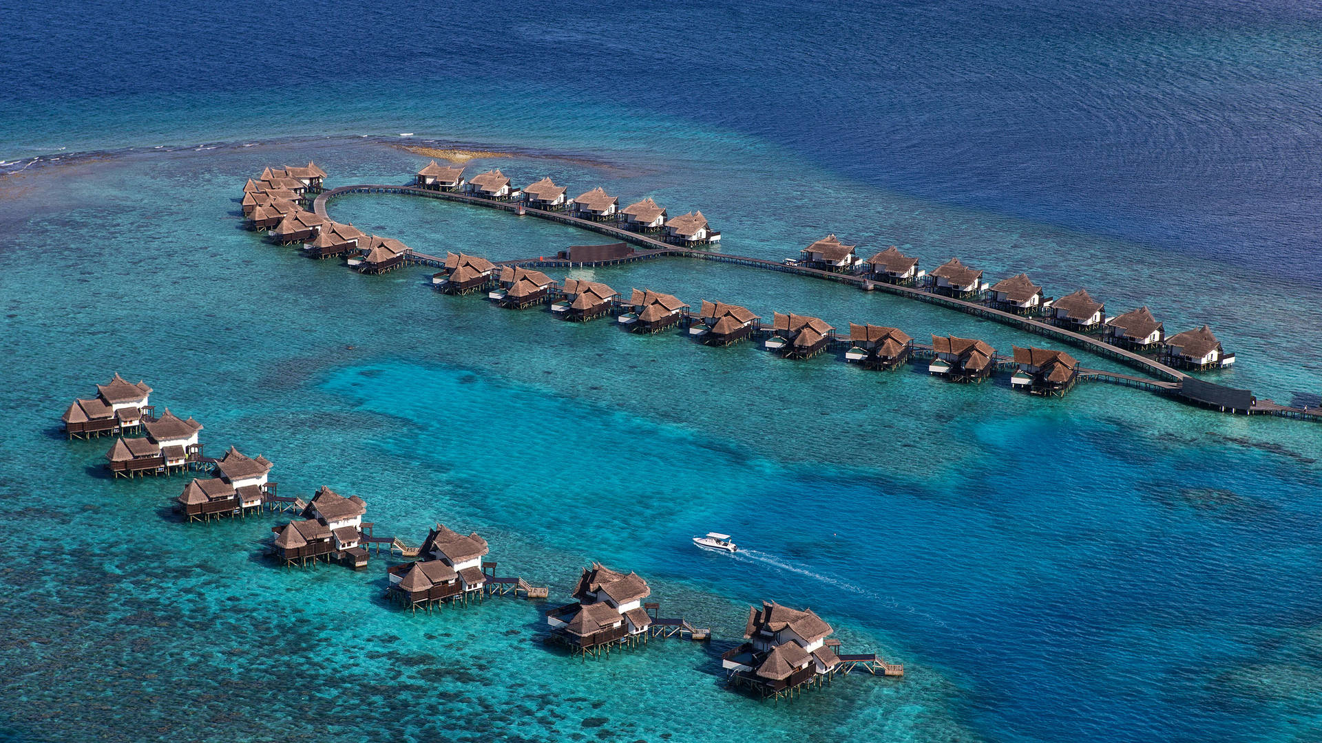 jumeirah vittaveli vista aérea de alojamientos privados, océano, agua, villas