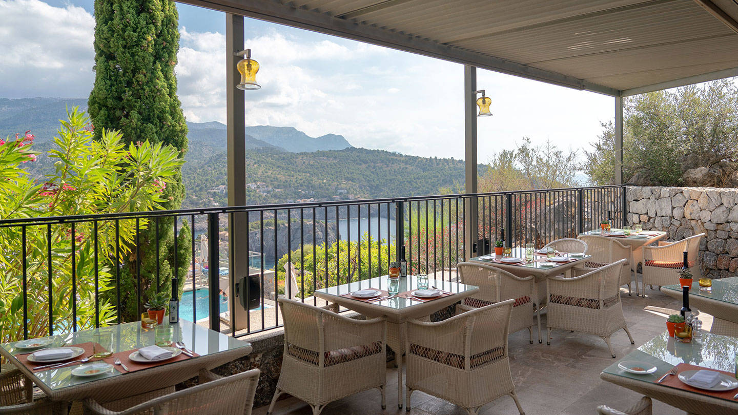 Es Fanals Terrace tables overlooking mountain view 
